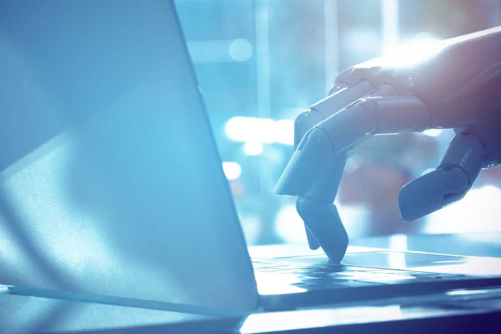 Robot finger point to laptop button with blue tone image. Chat bot , artificial intelligence , robo advisor , robotic concept.